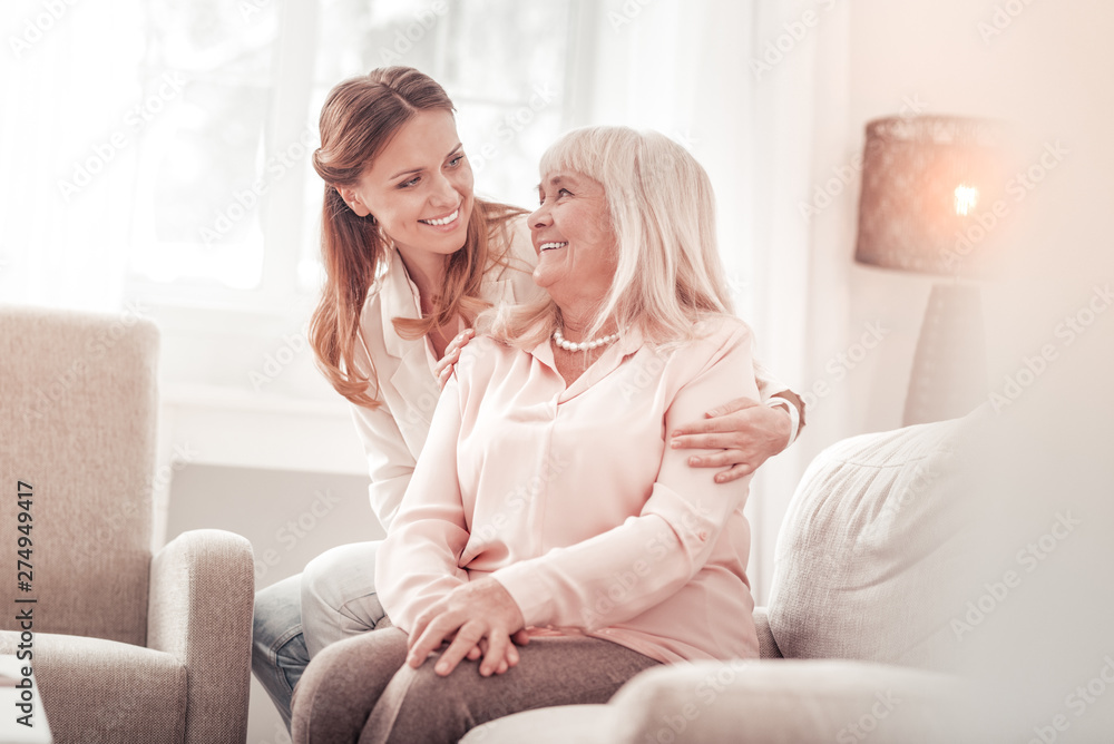 Fotografie Amazing mother and daughter smiling tenderly to each other