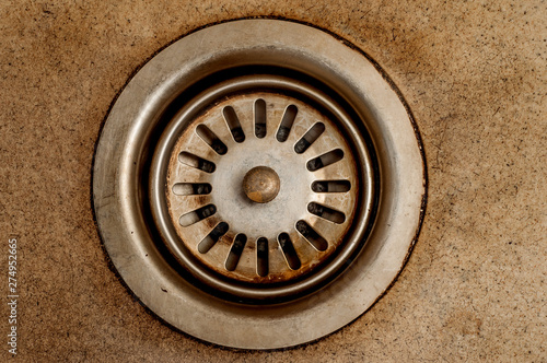 Dirty mesh sink with patina in the kitchen closeup