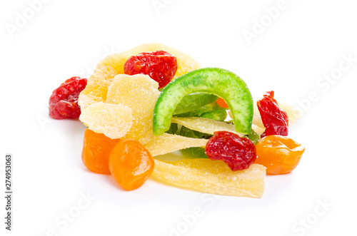 Pile candied dried tropical fruits on the white background isolation
