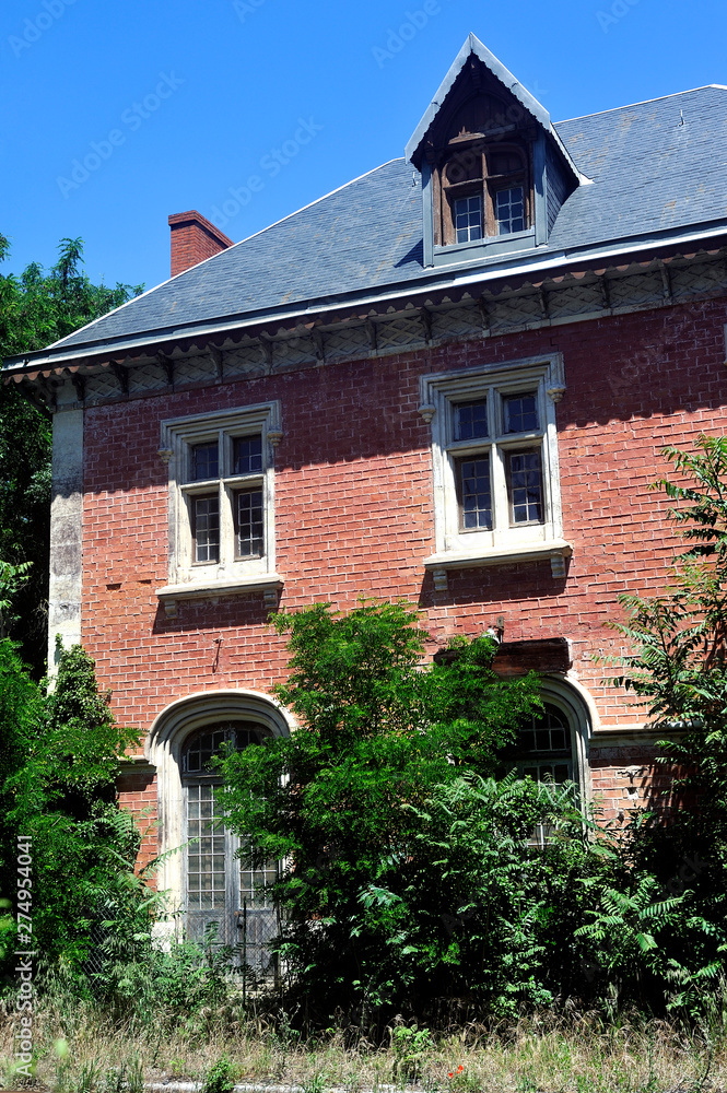 Abandoned train station with old red brick architecture