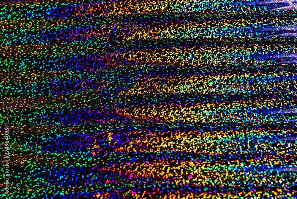 Photo of holographic real texture in rainbow colors, colorful iridescent surface. Holographic color wrinkled foil. Colored glitter. Shining background. Photo of holographic real texture in rainbow colors, colorful iridescent surface. Holographic color wrinkled foil. Colored glitter. Shining background.