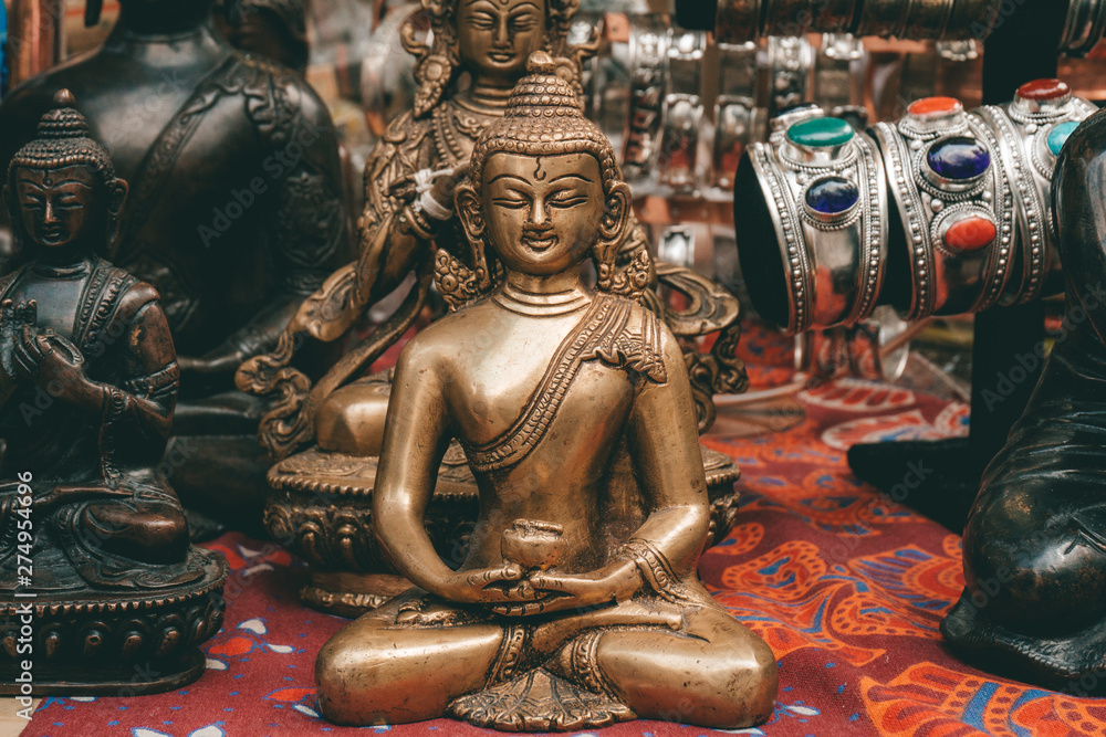 Buddha statuette in meditation. Souvenirs on the market in Kathmandu, Nepal. Buddha statuette in meditation. Souvenirs on the market in Kathmandu, Nepal.