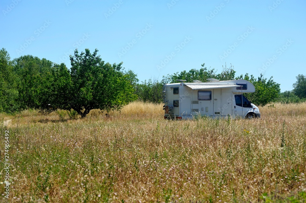 Camping car installed in the middle of the fields Camping car installed in the middle of the fields