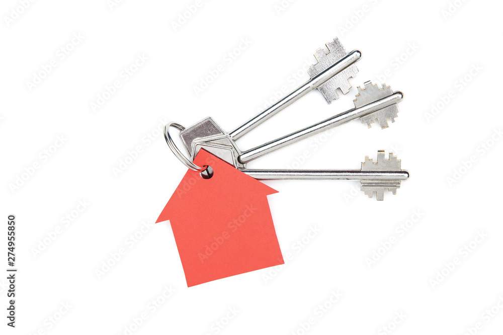 Silver keys with paper house isolated on white background Silver keys with paper house isolated on white background