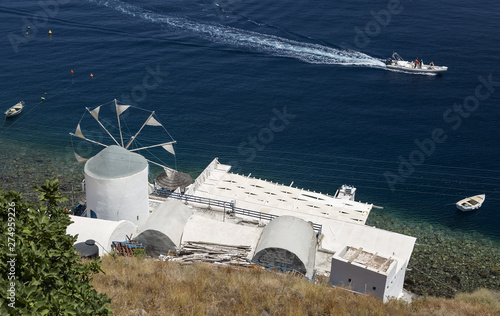Windmill building on the island of Thirassia in Santorini, Greece. photo