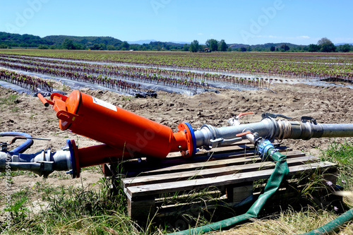 agricultural irrigation system that distributes water pumped into the river in the field