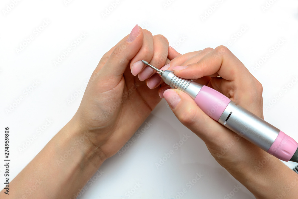 Nails Beauty. Closeup Of Woman Hands Receiving Nail Care Treatment.Manicurist Hands Cutting Cuticle On Nails With Nail Clippers Nails Beauty. Closeup Of Woman Hands Receiving Nail Care Treatment.Manicurist Hands Cutting Cuticle On Nails With Nail Clippers