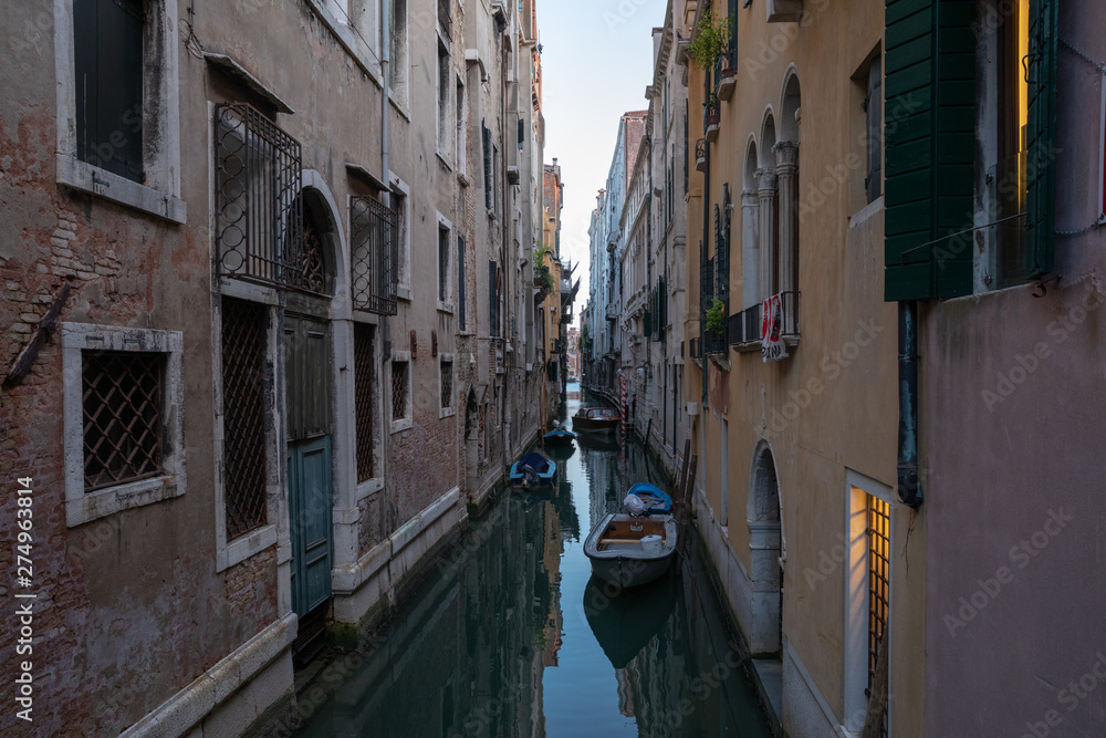 Panoramic view of Venice canal with historical buildings and gondolas