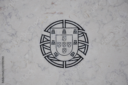 Coat of arms of Portugal engraved on stone. Version without laurel branches for use on the National Flag and naval jack photo