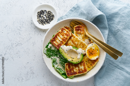 keto ketogenic diet soft boiled eggs with avocado and lettuce on pastel background top view copy space