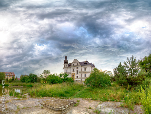 WROCLAW, POLAND - JUNE 21, 2019: Palace in Biskupice Podgorne near Wroclaw, Poland. Cloudy sky on the last day of spring. photo