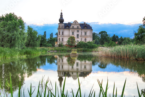 WROCLAW, POLAND - JUNE 21, 2019: Palace in Biskupice Podgorne near Wroclaw, Poland. Cloudy sky on the last day of spring. photo