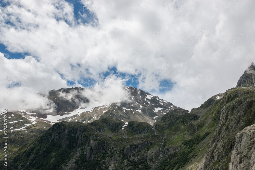 Closeup mountains scenes, walk to Trift Bridge in national park Switzerland Closeup mountains scenes, walk to Trift Bridge in national park Switzerland