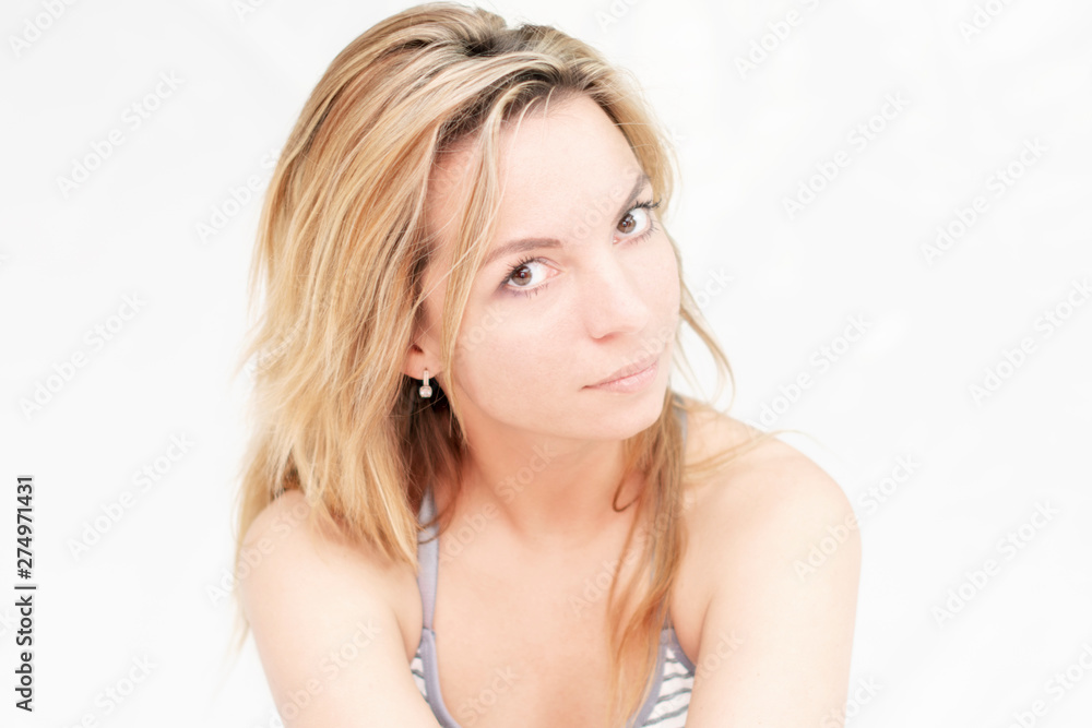 Portrait of beautiful sexy slim young woman with long hair and gentle look on white background. Portrait of beautiful sexy slim young woman with long hair and gentle look on white background.