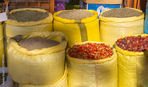 Sacks of spices at a stall in a bazaar in Tangier in Morocco