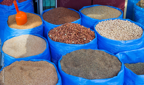 Sacks of spices at a stall in a bazaar in Tangier in Morocco