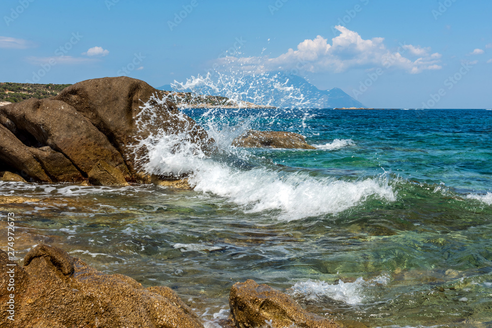 Obraz premium Landscape with sea, the rock and the beautiful clouds in the blue sky