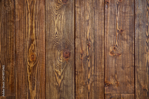 Wood Material Background Wallpaper Texture Concept .Old brown board in warm colors. Dark old wooden table texture background top view . vertical wooden background .