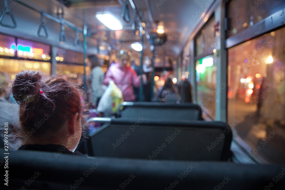 People in old public bus, view from inside the bus . People sitting on a comfortable bus in Selective focus and blurred background. s the main mass transit passengers in the bus. People in old public bus, view from inside the bus . People sitting on a comfortable bus in Selective focus and blurred background. s the main mass transit passengers in the bus.