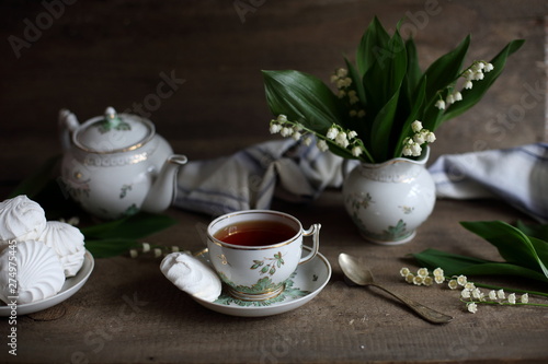 tea with marshmallows and lilies of the valley