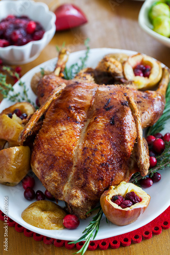 Festive roast duck with apples and cranberries