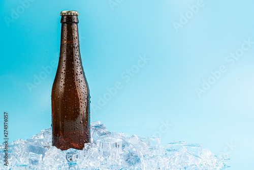 closed brown glass beer bottle on ice