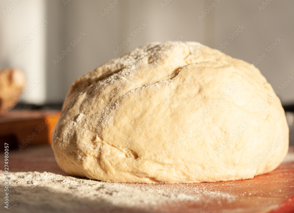 Ball of fresh dough, bathed in warm evening sunlight Ball of fresh dough, bathed in warm evening sunlight