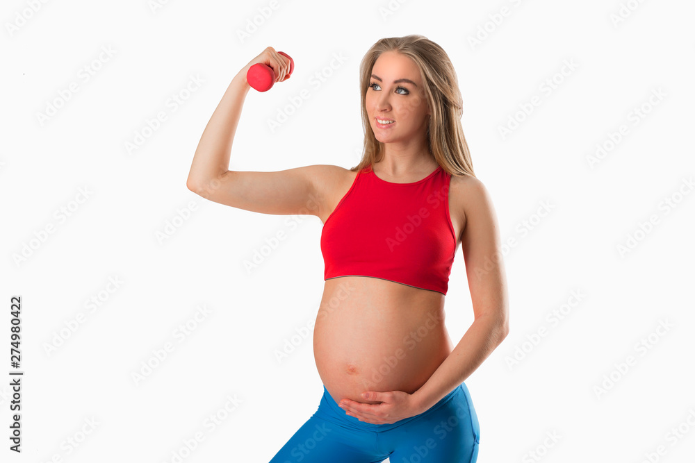 beautiful young pregnant woman with dumbbell in hand on white background beautiful young pregnant woman with dumbbell in hand on white background