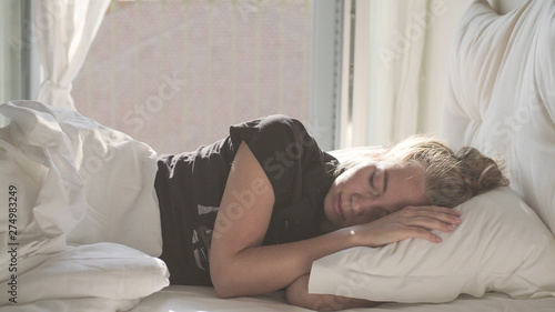 Teenage Girl Sleeping in Bed