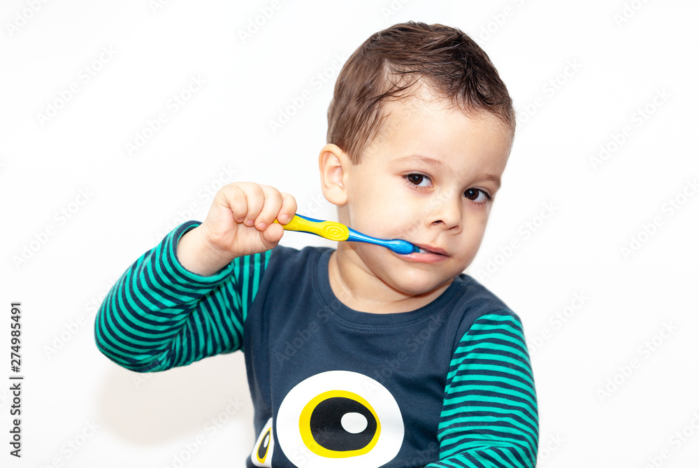 little kid brushing his teeth smiling happy isolated on white background little kid brushing his teeth smiling happy isolated on white background