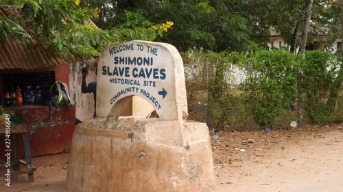 Static shot of the Shimoni slave caves sign, in Kwale, Kenya, Africa photo