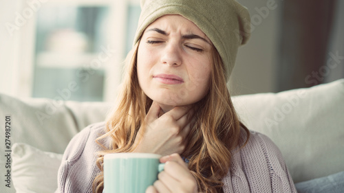 Young woman suffering from cold photo