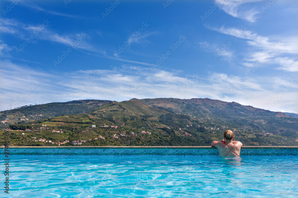 Young woman relaxing on swimming pool Young woman relaxing on swimming pool