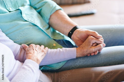 Senior man and woman in casualwear holding by hands © pressmaster