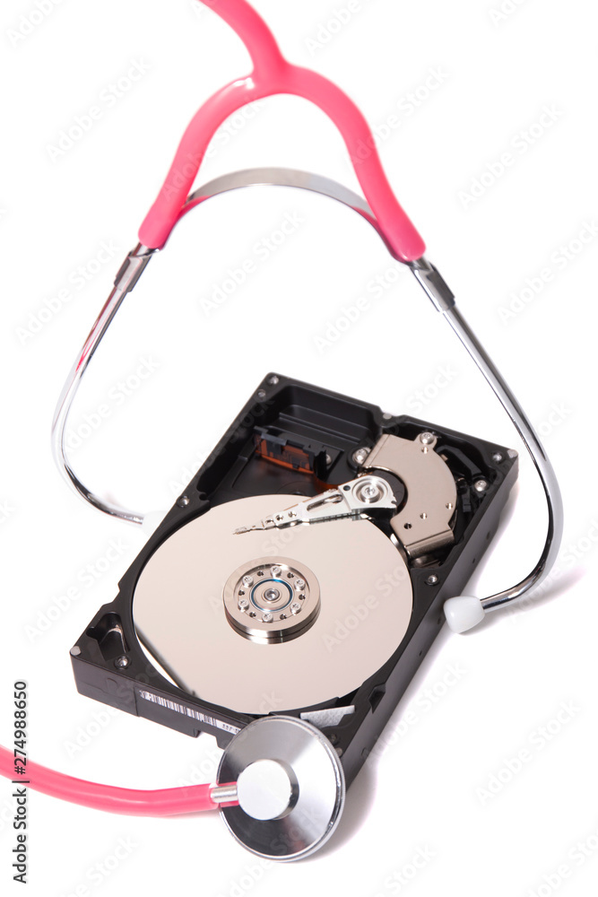 computer hard drive with pink stethoscope computer hard drive with pink stethoscope