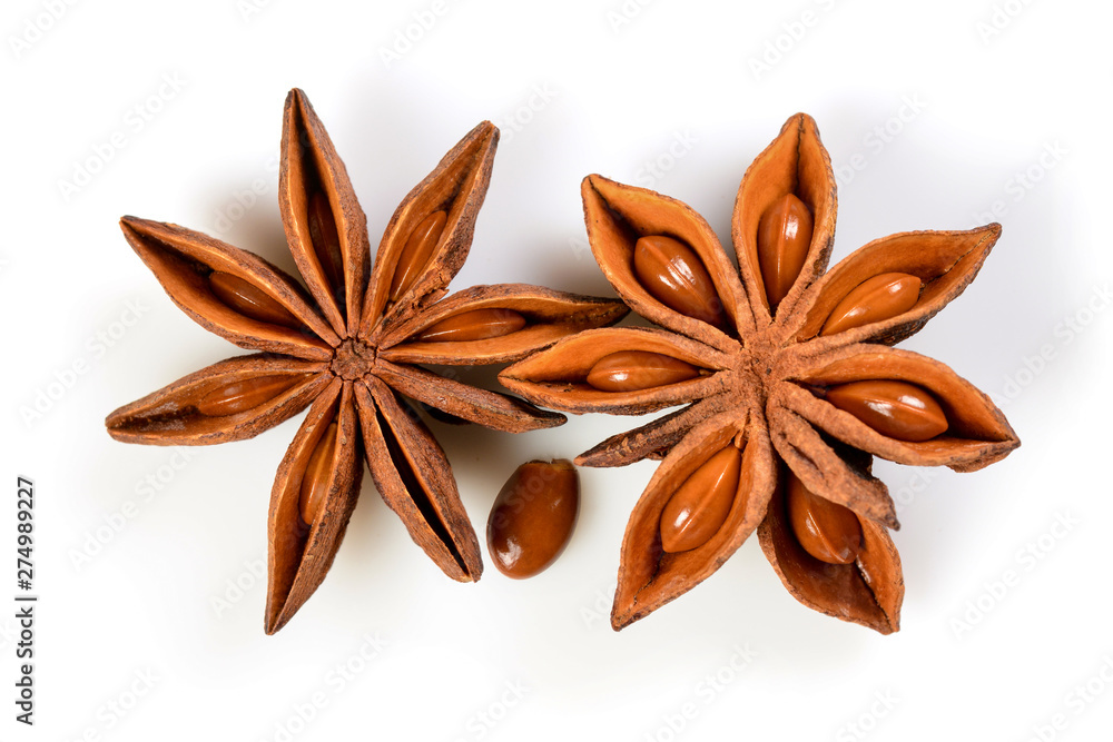 Star anise. Two star anise fruits with seed. Macro close up Isolated on white background with shadow, top view of chinese badiane spice or Illicium verum. Star anise. Two star anise fruits with seed. Macro close up Isolated on white background with shadow, top view of chinese badiane spice or Illicium verum.