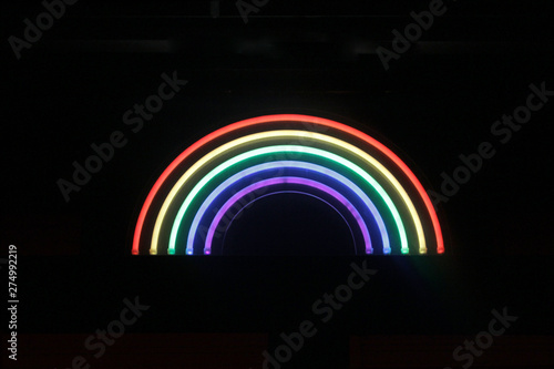 Fototapeta Naklejka Na Ścianę i Meble -  Pride Neon Rainbow Symbol on Black Background - Isolated Graphic