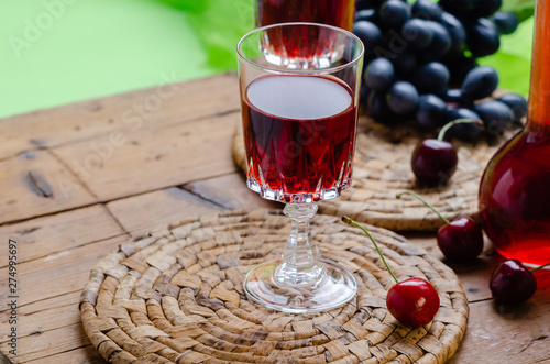 Foto Ratafia - tipical Italian sweet alcoholic beverage, either a fruit-based beverage or a fortified wine with cherries