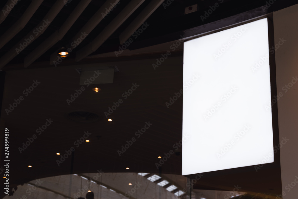 Blank white screen vertical signage mockup hanging on ceiling. Signboard for advertisement design in a shopping center, gallery. Blank white screen vertical signage mockup hanging on ceiling. Signboard for advertisement design in a shopping center, gallery.