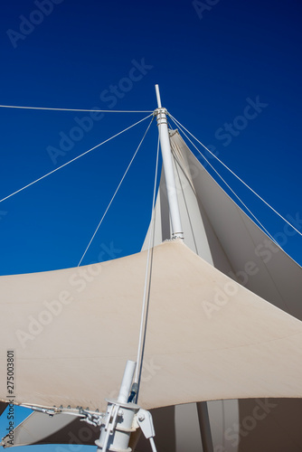 The white arbor was set against a blue sky