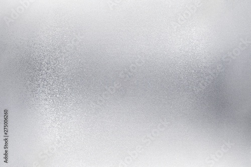 Glowing brushed silver foil metallic wall, abstract texture background