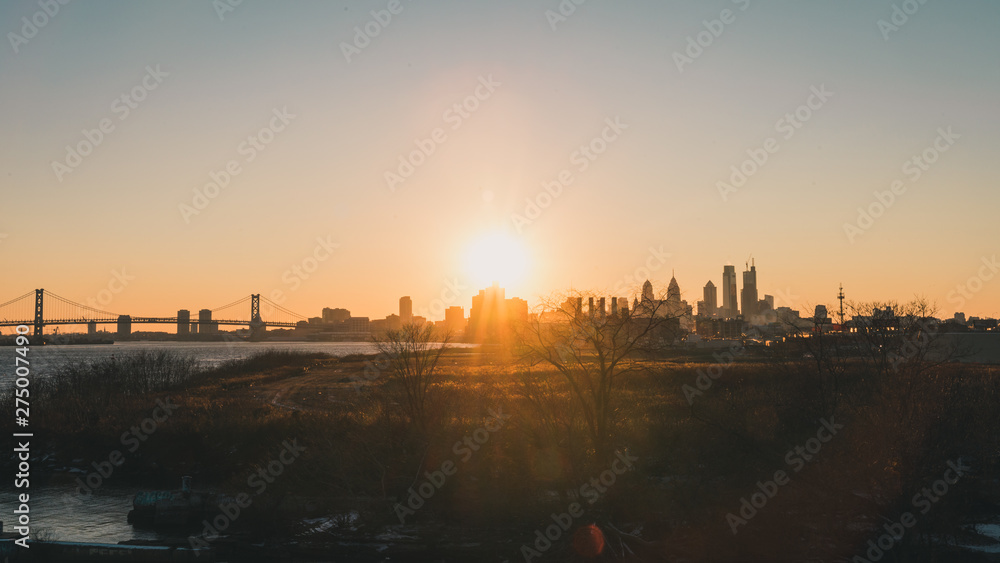 Sunset over Philadelphia skyline with lens flare