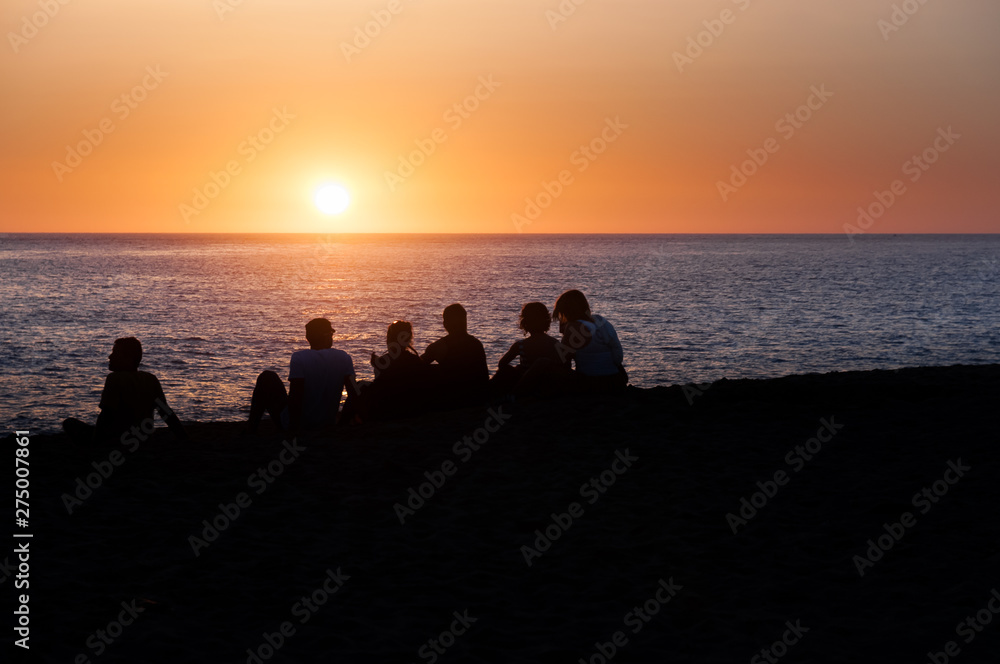 people sunset on the beach