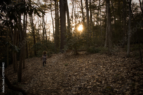 child running in forest © Liz