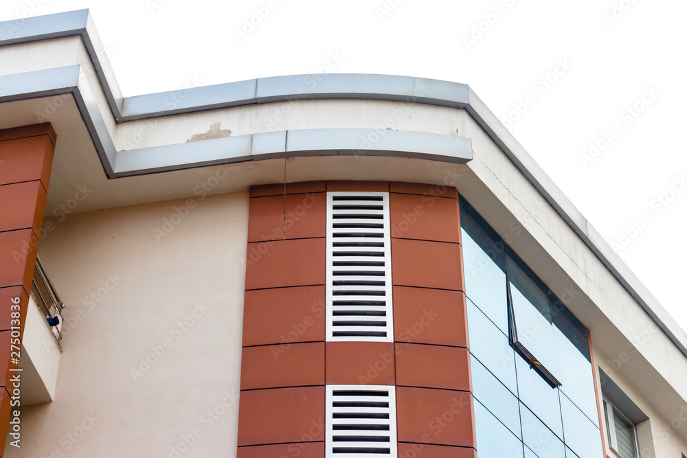 a corner shoot from a modern building with red bricks on it