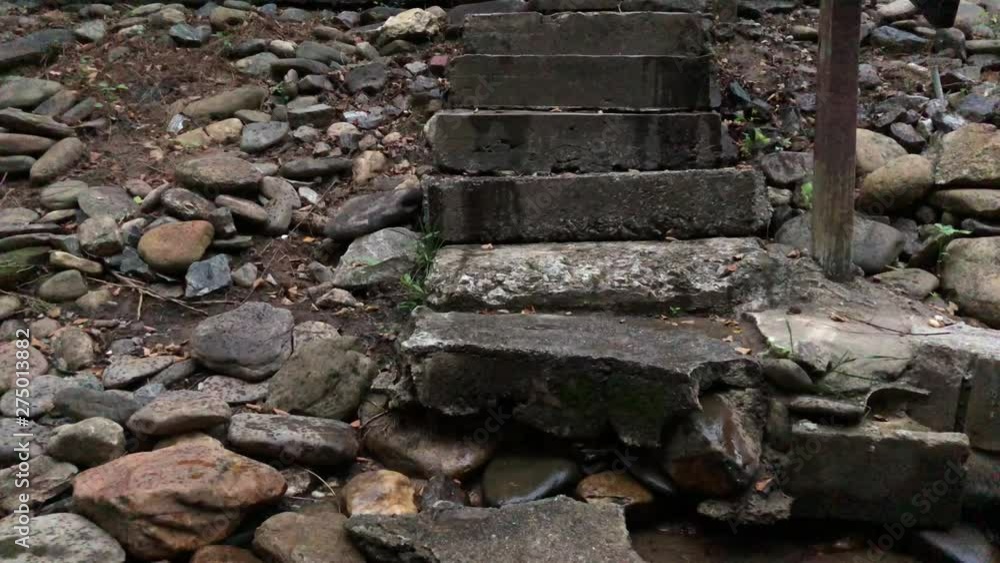 Creepy rock stairs leading into river Creepy rock stairs leading into river