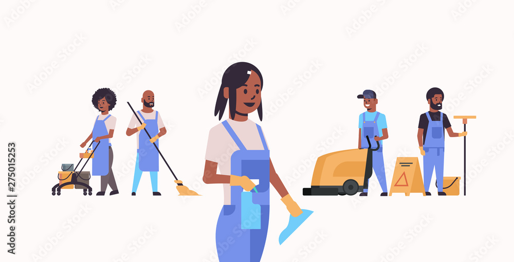janitors team working together cleaning service concept african american male female cleaners in uniform using professional equipment flat full length horizontal