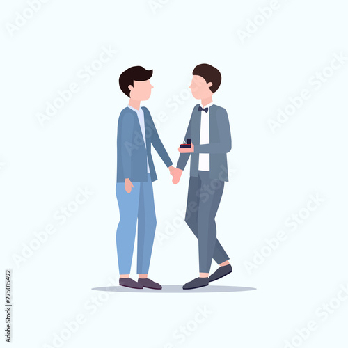 Man gay holding engagement ring proposing boyfriend