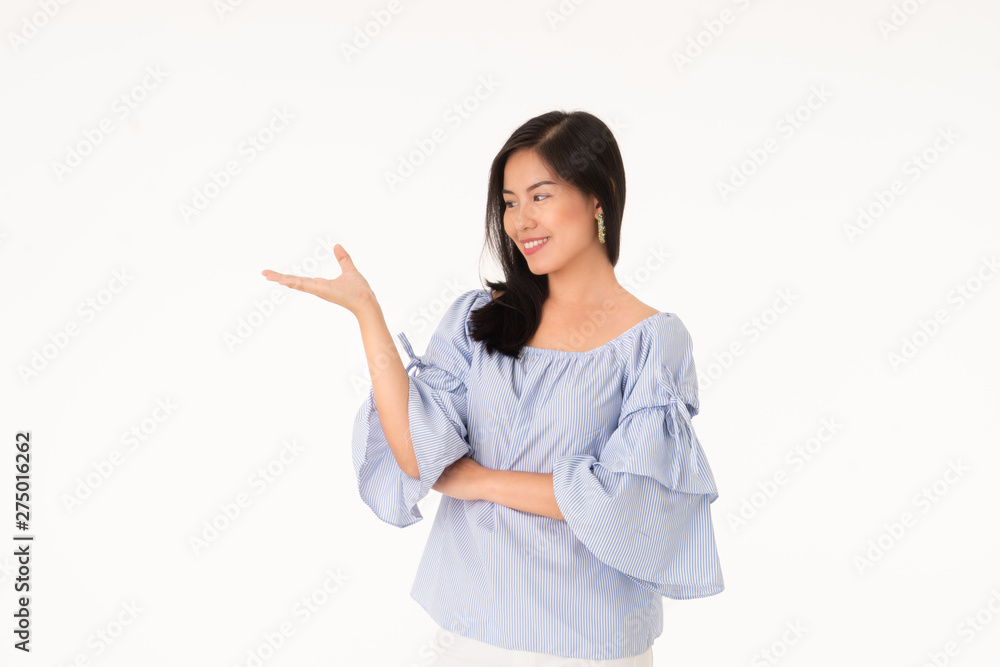 Portrait of Asian young woman is looking her hand isolated on white background Portrait of Asian young woman is looking her hand isolated on white background