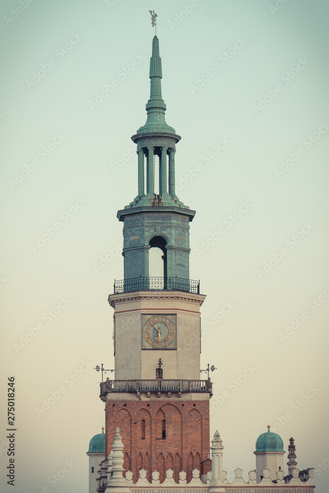 Poznan, Poland - October 12, 2018: View at sunset on tower of town hall in polish city Poznan. Vintage photo